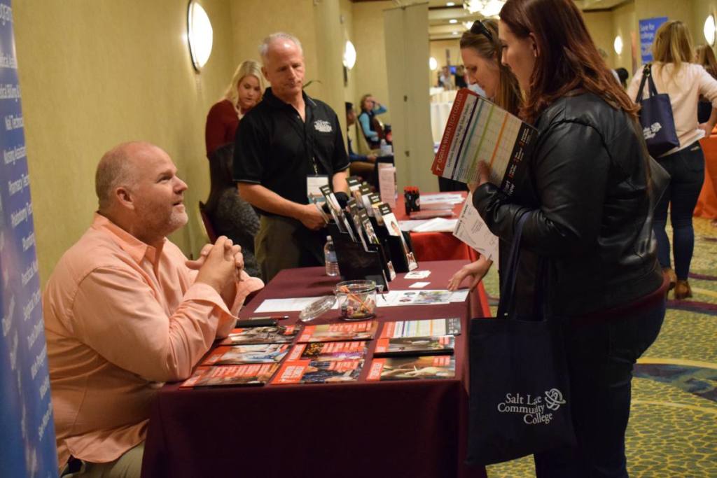 Attendees chat with college reps at the USHE Counselor Conference on Sept. 29, 2017.