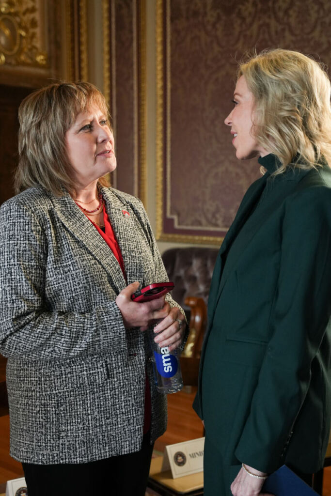 SUU President Mindy Benson speaking with Board Chair Covington