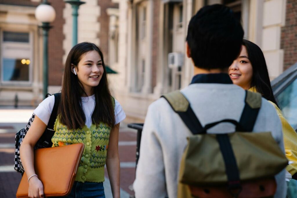 Students chatting outside a building