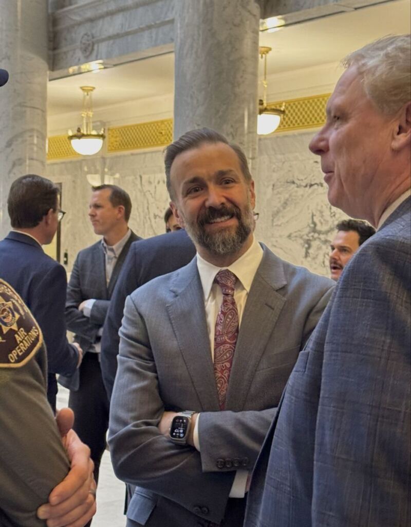 Commissioner Geoffrey Landward in conversation at the USHE day on the hill breakfast