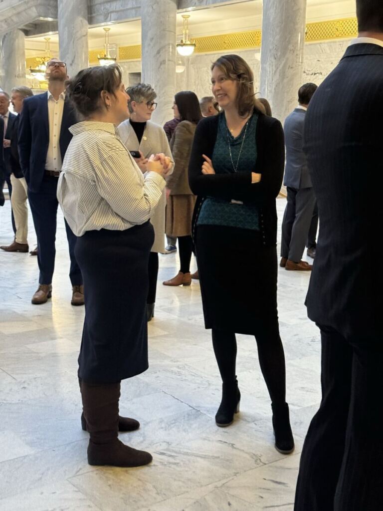 Rep. Karen Peterson in conversation at the USHE day on the hill breakfast