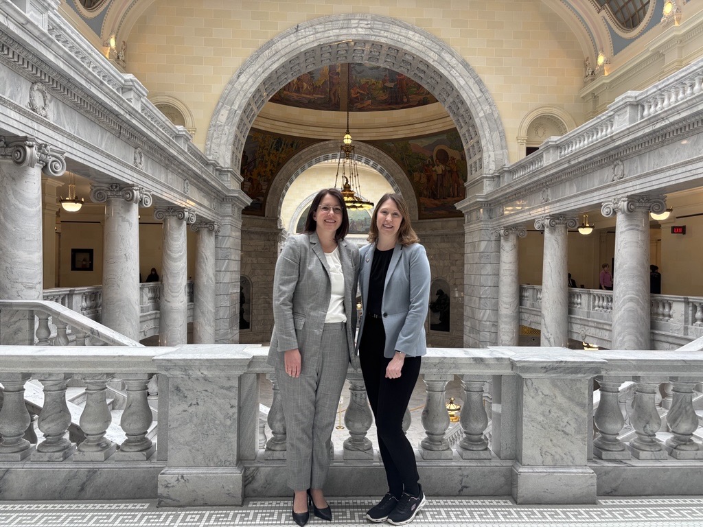 Utah System of Higher Education Associate Commissioner Katie Mazzie and Representative Karen Peterson standing in front of the Capitol Rotunda