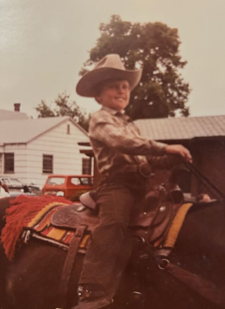 A childhood photo of Jon Anderson riding a horse.
