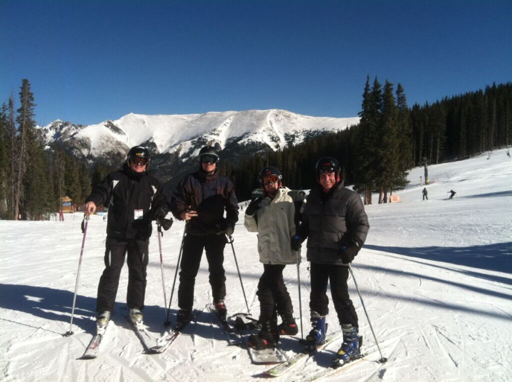 Jon Anderson skiing with his dad and brothers.